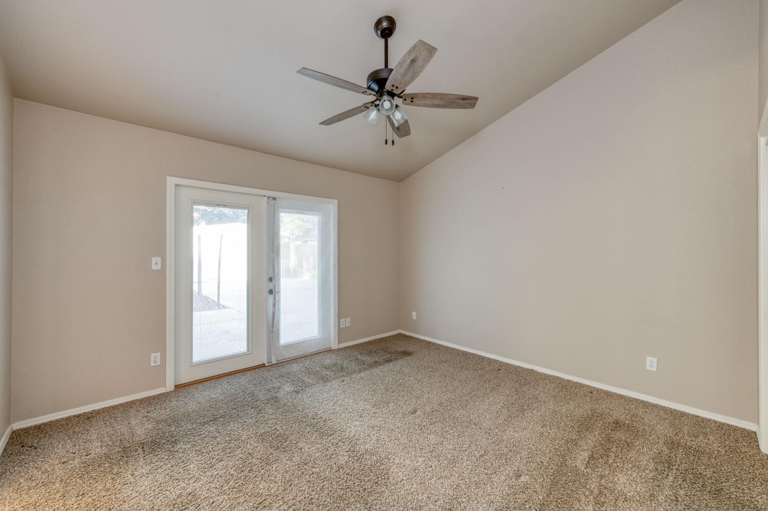 2365 Fallbrook Avenue Clovis, CA 93611 - Photo 25 of 42 an empty room with a ceiling fan and window