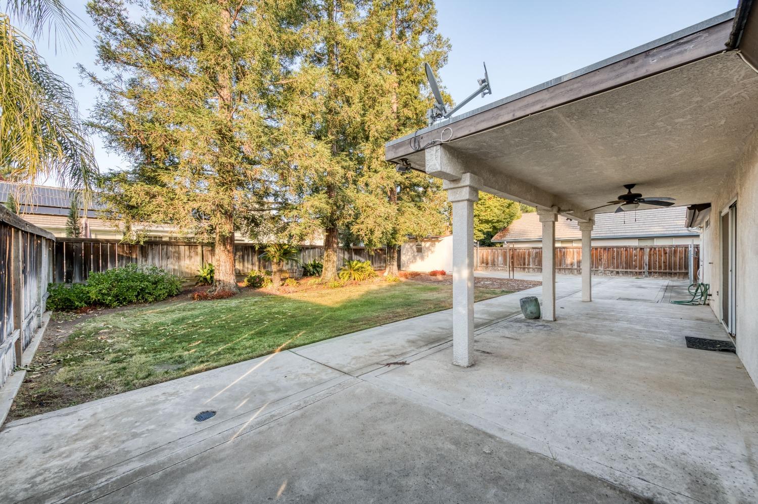 2365 Fallbrook Avenue Clovis, CA 93611 - Photo 31 of 42 a view of a house with backyard and tree
