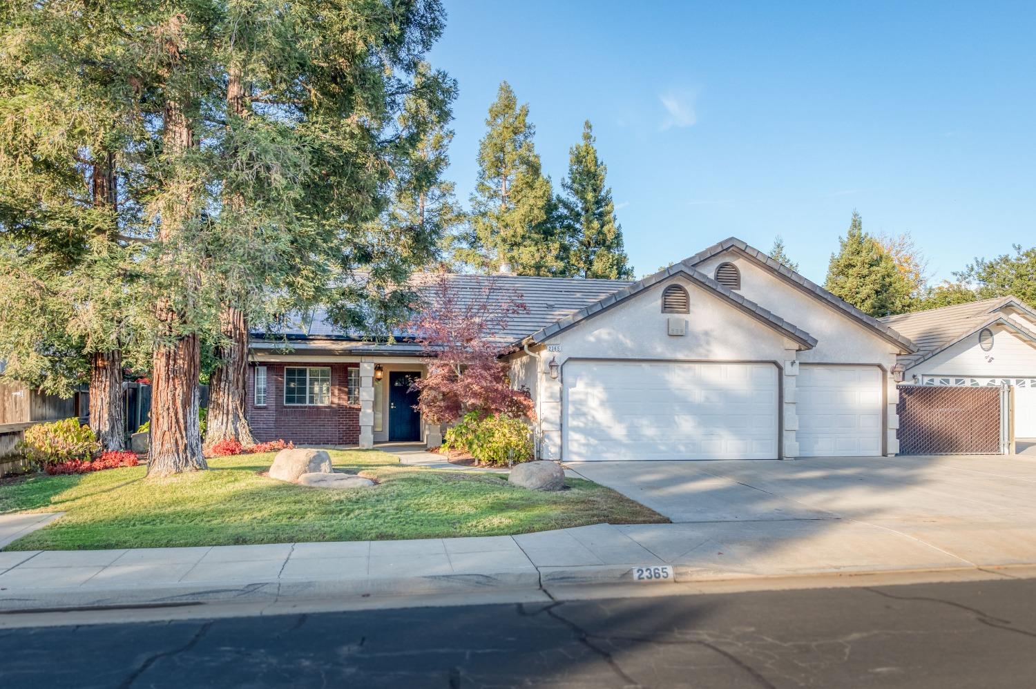 2365 Fallbrook Avenue Clovis, CA 93611 - Photo 4 of 42 front view of a house with a yard
