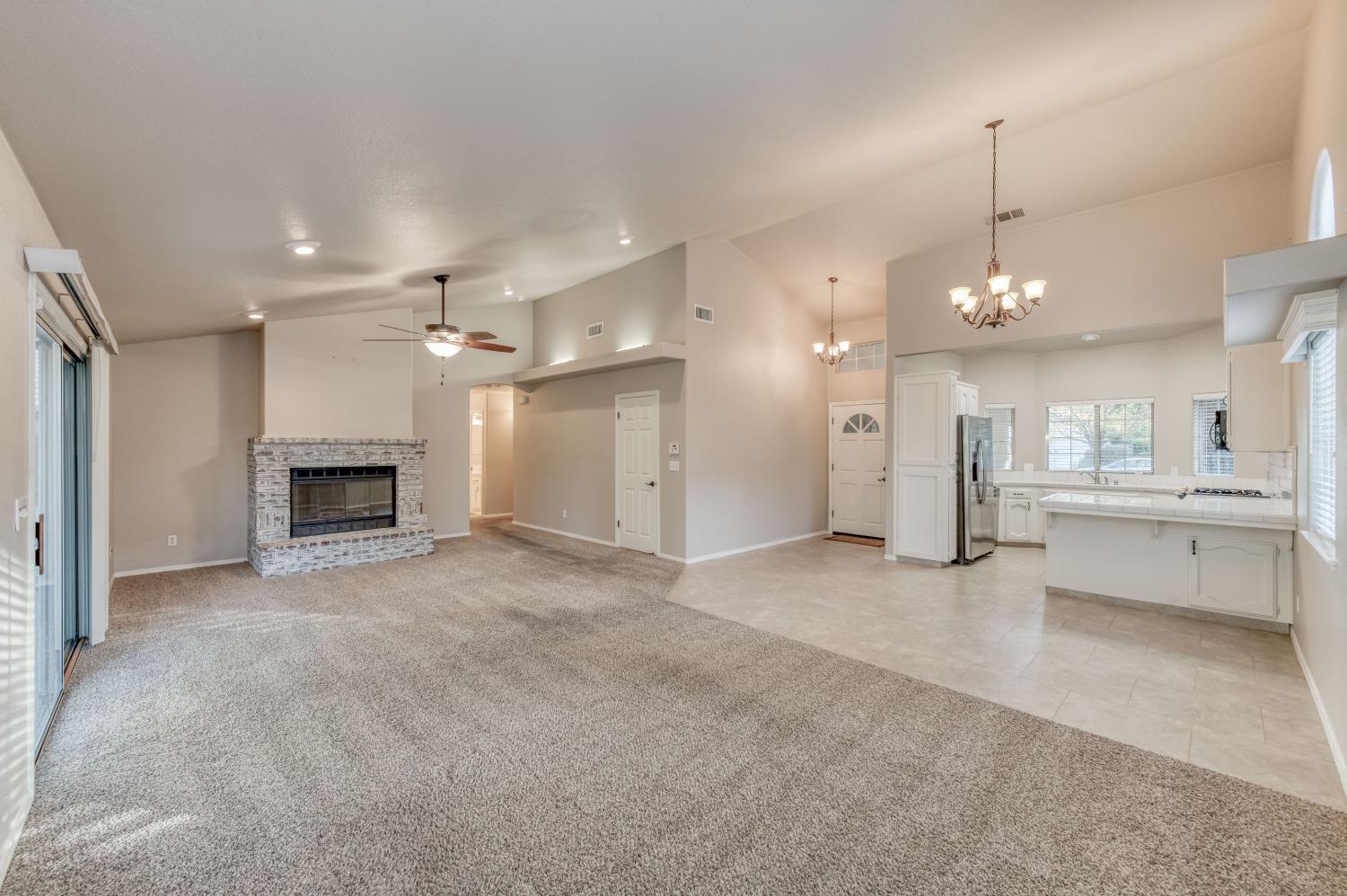 2365 Fallbrook Avenue Clovis, CA 93611 - Photo 10 of 42 a view of a kitchen and a chandelier fire place