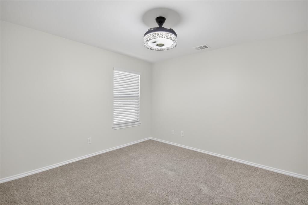 827 Rustic Way Royse City, TX 75189 - Photo 11 of 32 an empty room with a window
