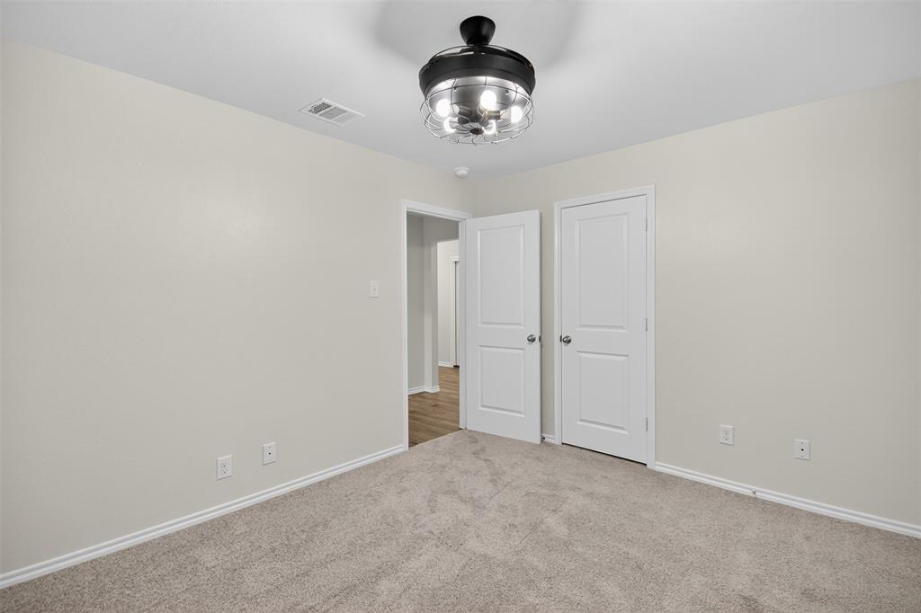 827 Rustic Way Royse City, TX 75189 - Photo 14 of 32 a very nice looking room with a chandelier fan and kitchen view