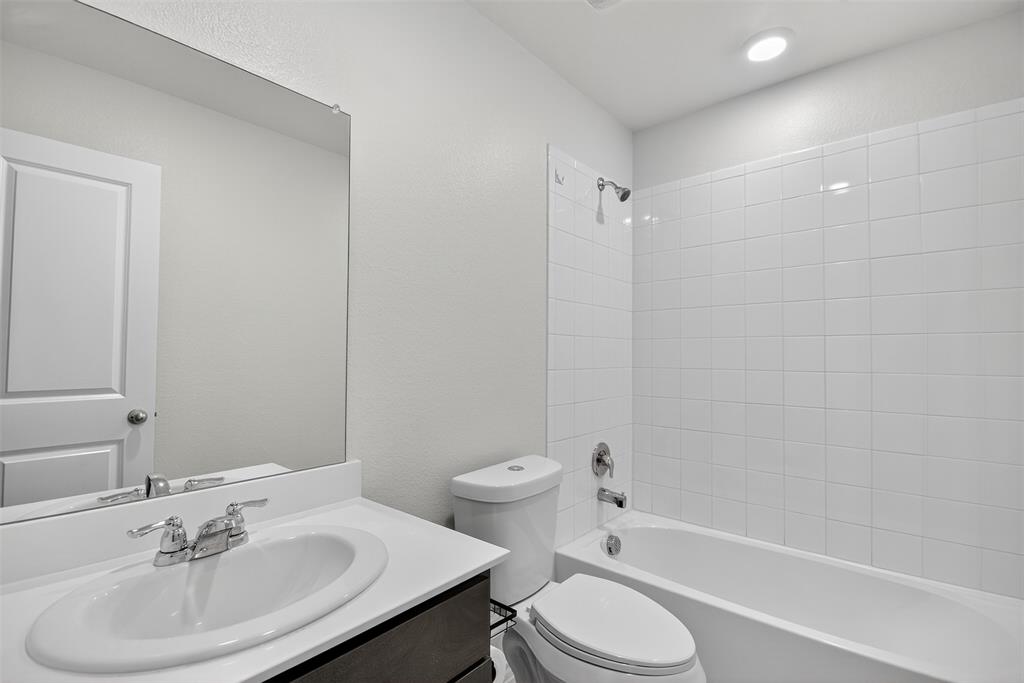827 Rustic Way Royse City, TX 75189 - Photo 15 of 32 a bathroom with a sink toilet and shower