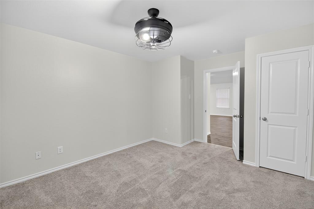827 Rustic Way Royse City, TX 75189 - Photo 23 of 32 wooden floor in an empty room
