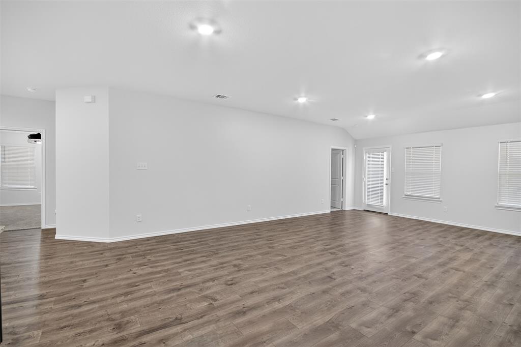 827 Rustic Way Royse City, TX 75189 - Photo 25 of 32 a view of an empty room with wooden floor