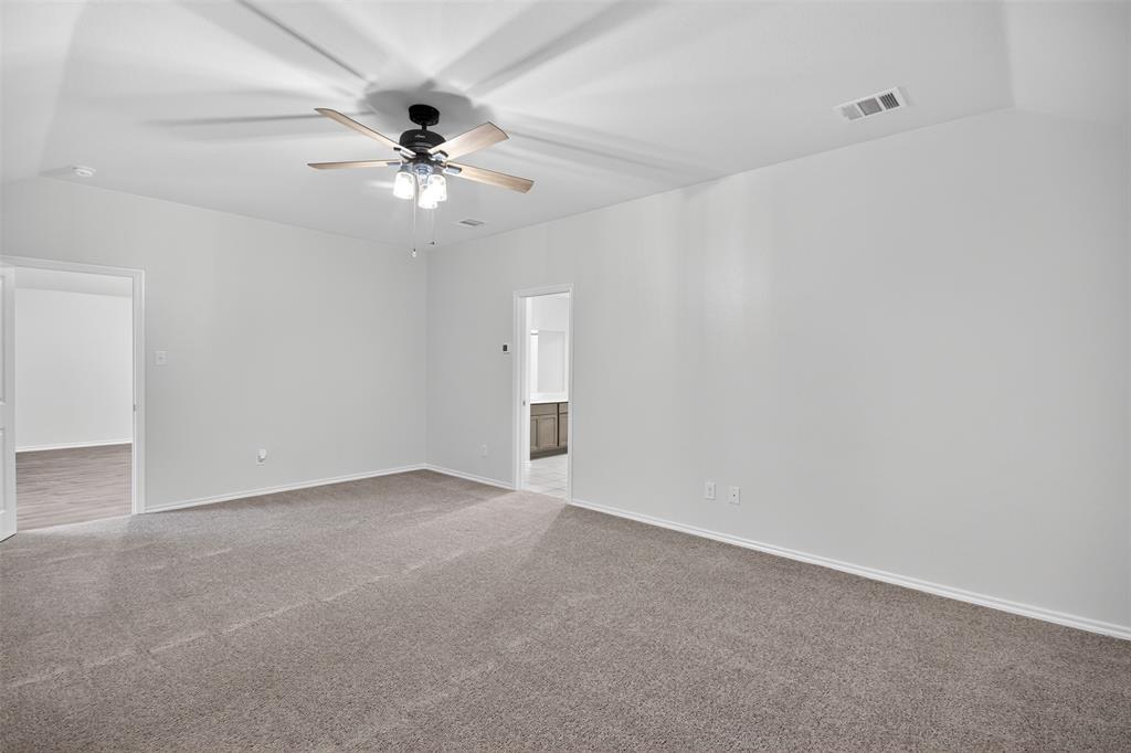 827 Rustic Way Royse City, TX 75189 - Photo 28 of 32 an empty room with a ceiling fan and a ceiling fan