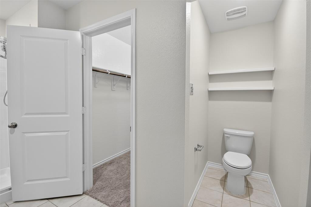 827 Rustic Way Royse City, TX 75189 - Photo 30 of 32 a bathroom with a toilet