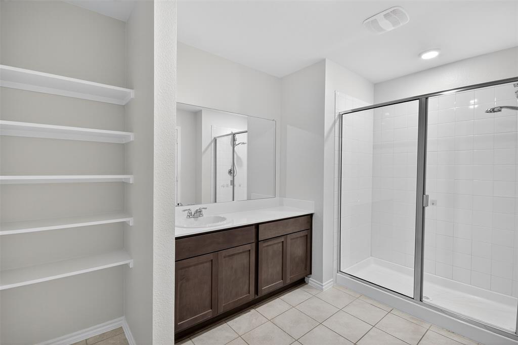 827 Rustic Way Royse City, TX 75189 - Photo 32 of 32 a bathroom with a double vanity sink and mirror