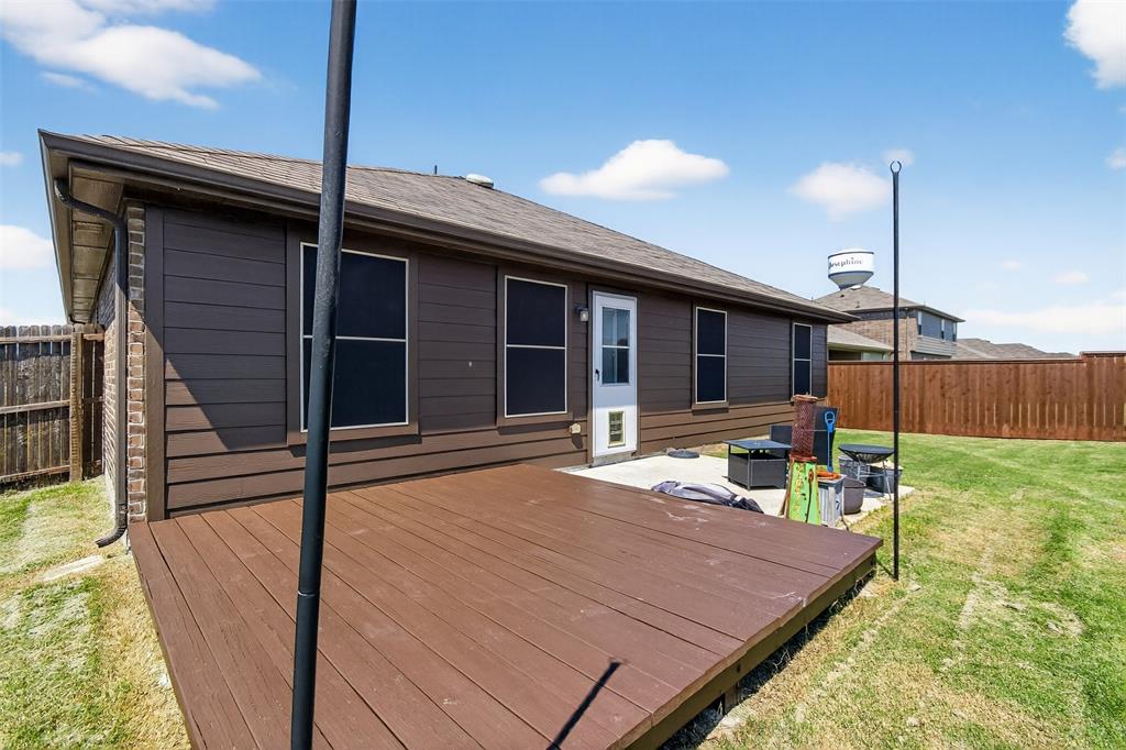 827 Rustic Way Royse City, TX 75189 - Photo 9 of 32 a patio with a table and chairs and potted plants