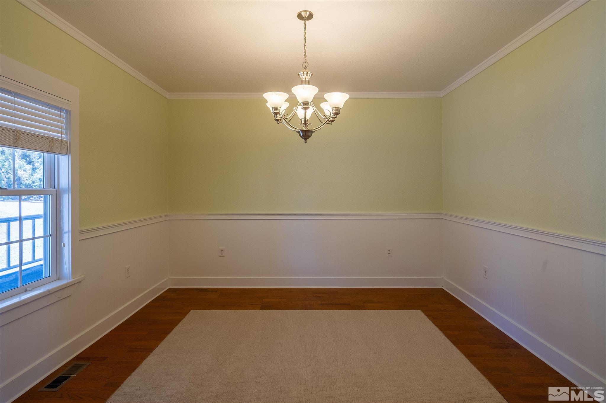 2035 Applegate Road Reno, NV 89521 - Photo 12 of 40 a view of a chandelier in an empty room
