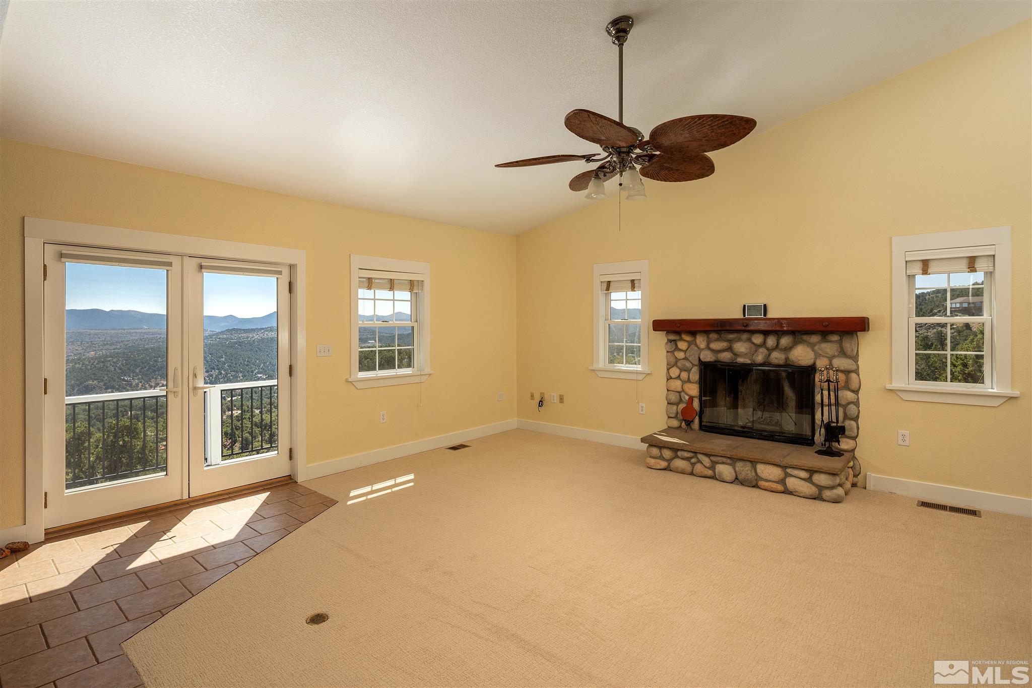 2035 Applegate Road Reno, NV 89521 - Photo 13 of 40 a view of a livingroom with a fireplace and window