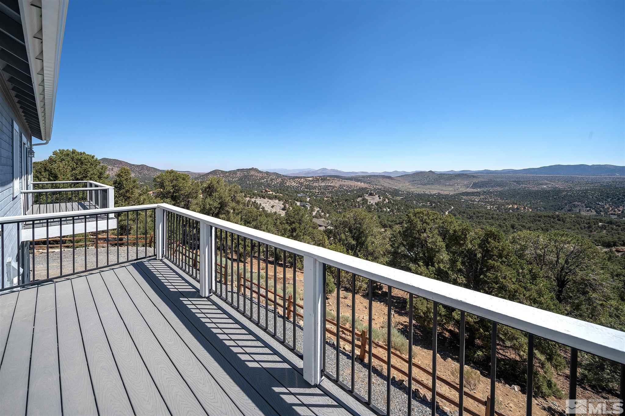 2035 Applegate Road Reno, NV 89521 - Photo 15 of 40 a view of city and mountain from a balcony