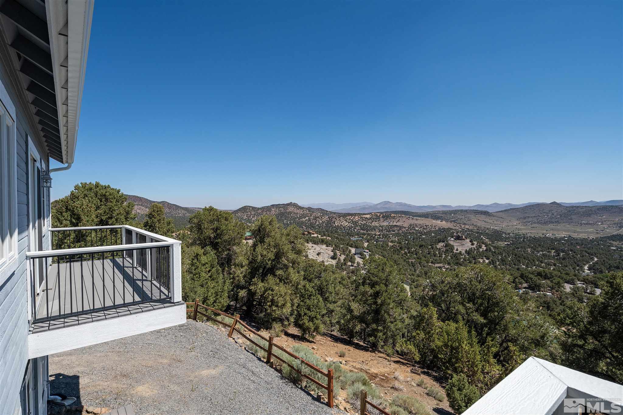 2035 Applegate Road Reno, NV 89521 - Photo 17 of 40 a view of balcony with wooden floor and mountain view