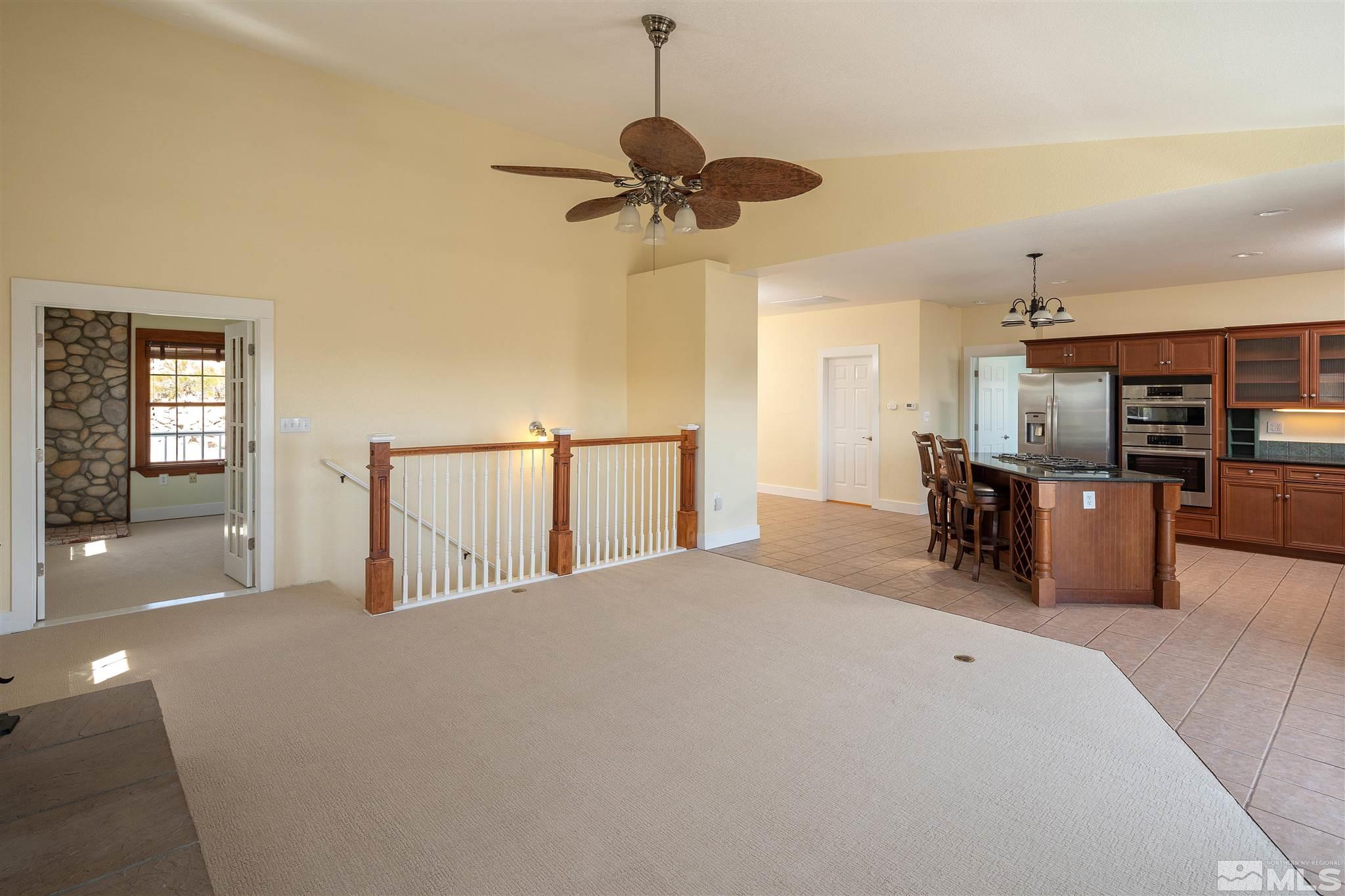 2035 Applegate Road Reno, NV 89521 - Photo 23 of 40 a view of a livingroom with furniture and a ceiling fan