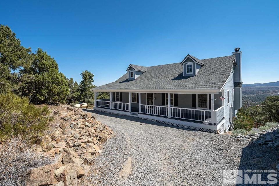 2035 Applegate Road Reno, NV 89521 - Photo 3 of 40 a front view of a house with a yard