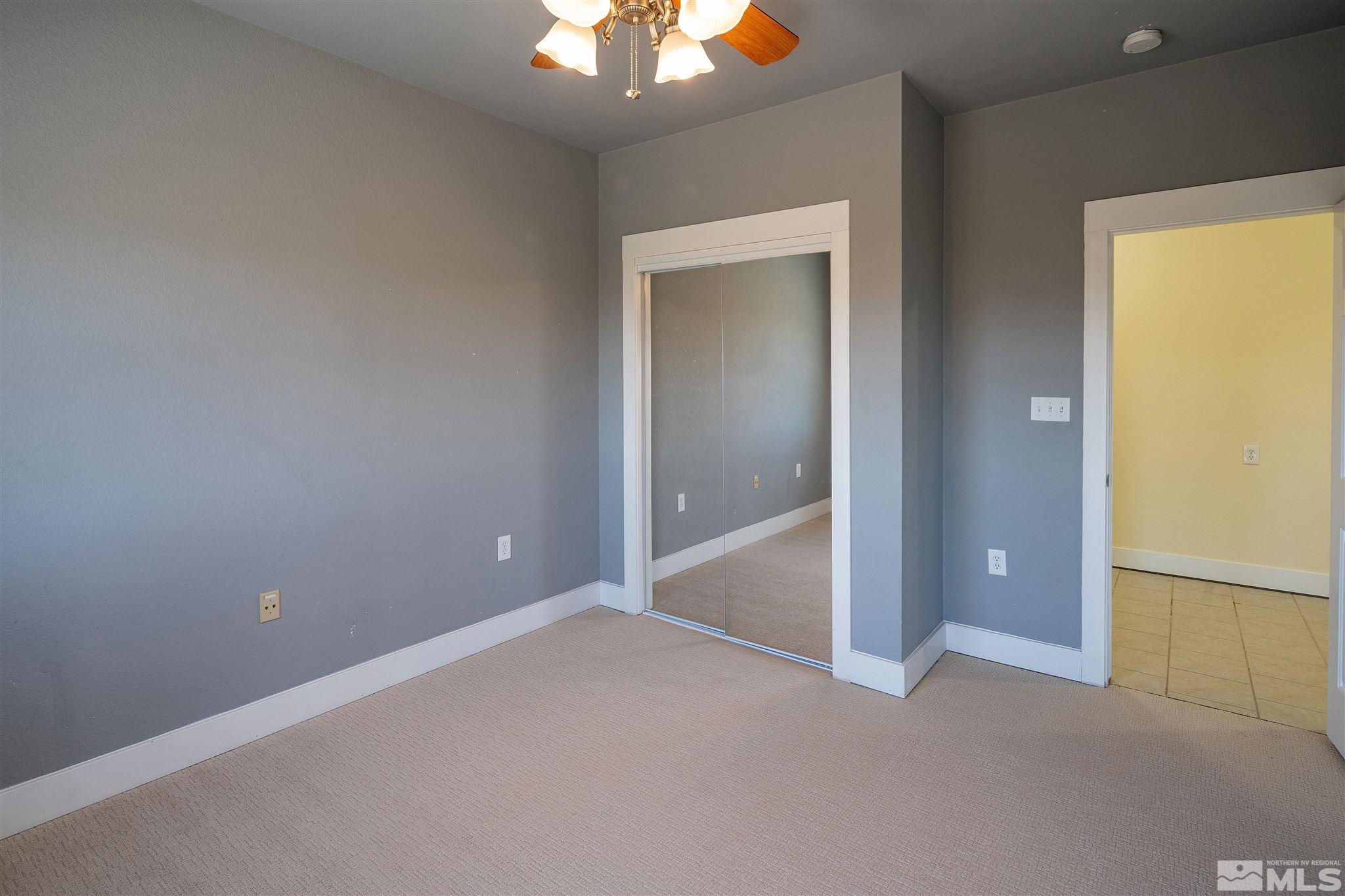 2035 Applegate Road Reno, NV 89521 - Photo 32 of 40 an empty room with closet and mirror