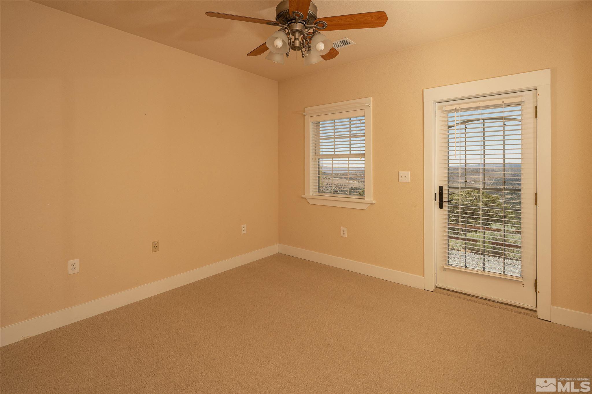 2035 Applegate Road Reno, NV 89521 - Photo 34 of 40 an empty room with windows and fan