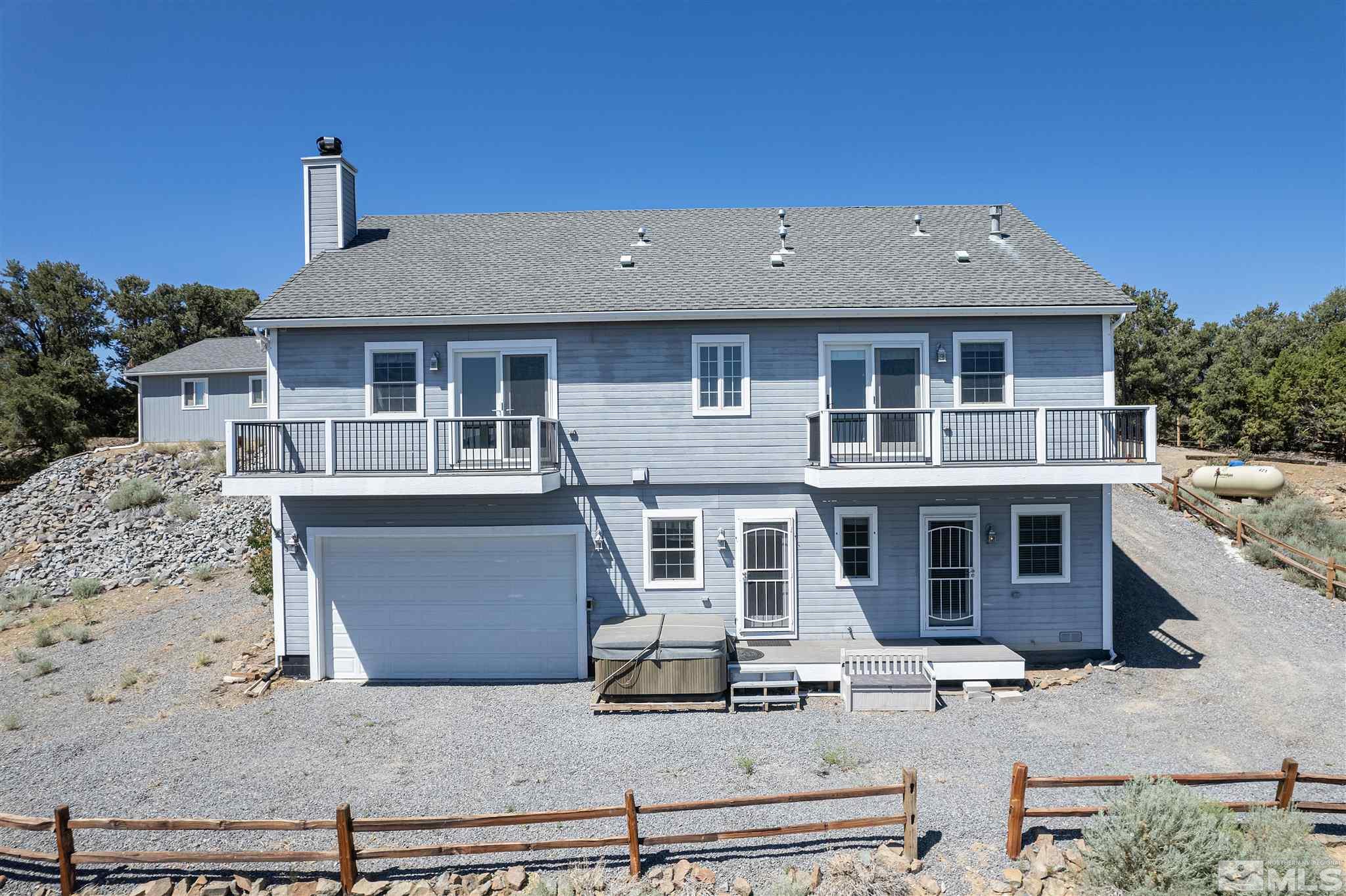2035 Applegate Road Reno, NV 89521 - Photo 6 of 40 a aerial view of a house with large windows and a yard