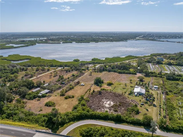 an aerial view of a city and lake view