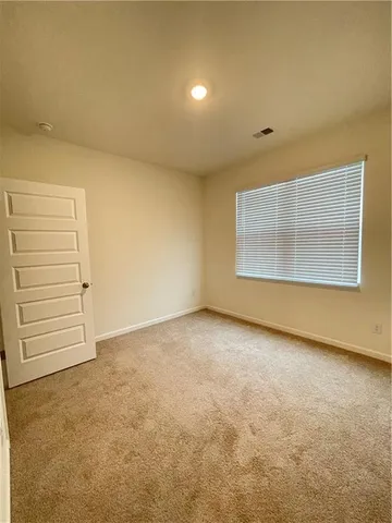 an empty room with a hallway