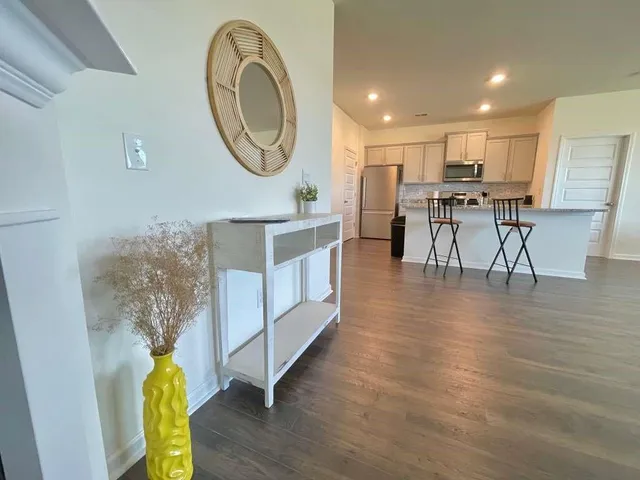 a view of kitchen with furniture and wooden floor