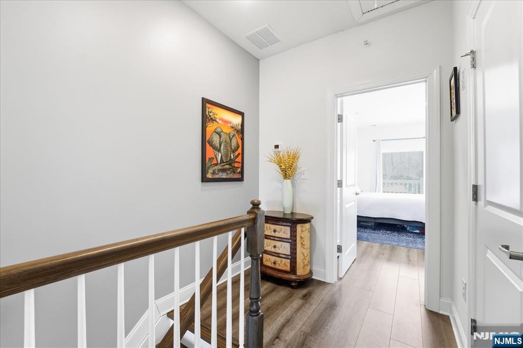 905 Abbe Road Little Falls, NJ 07424 - Photo 16 of 26 a view of hallway with wooden floor