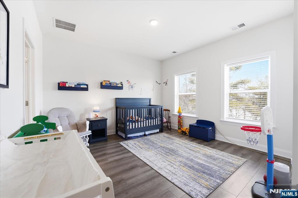 905 Abbe Road Little Falls, NJ 07424 - Photo 17 of 26 a bedroom with furniture and a bed