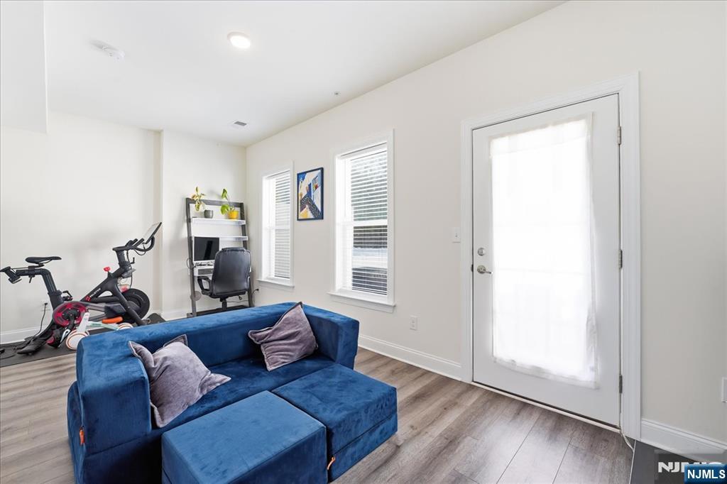 905 Abbe Road Little Falls, NJ 07424 - Photo 20 of 26 a living room with furniture and wooden floor