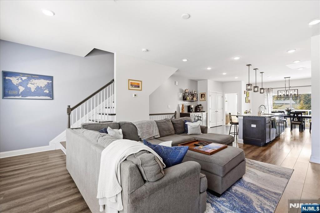 905 Abbe Road Little Falls, NJ 07424 - Photo 2 of 26 a living room with furniture and wooden floor