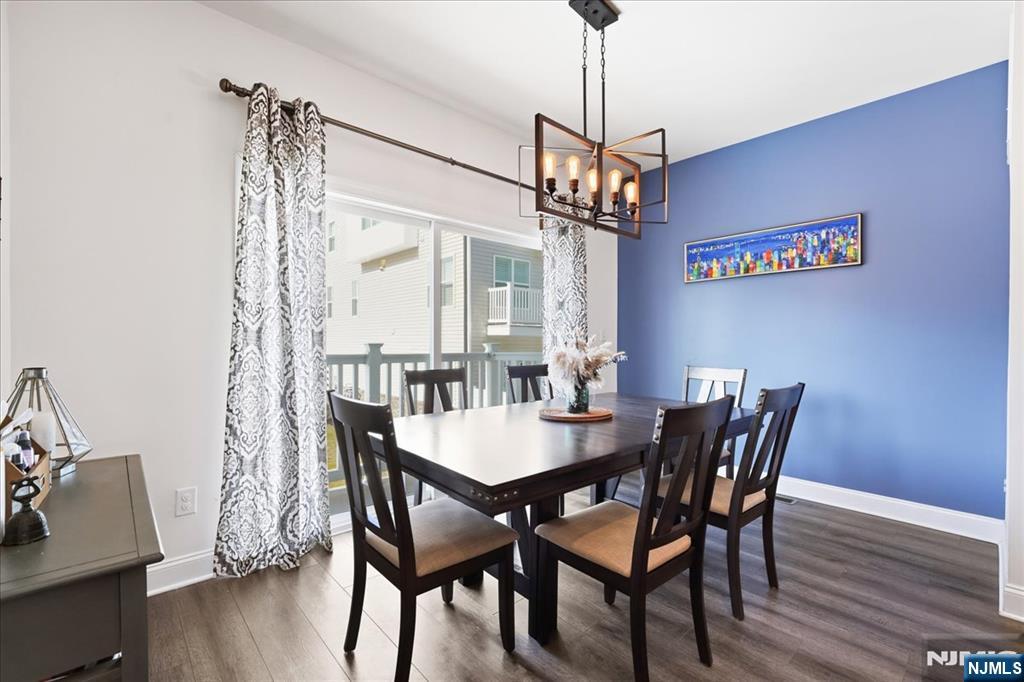 905 Abbe Road Little Falls, NJ 07424 - Photo 9 of 26 a view of a dining room with furniture window and wooden floor