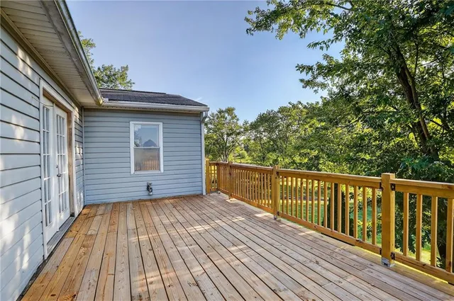 a view of a backyard with wooden floor
