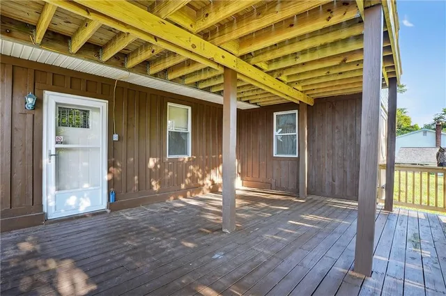 a front view of a house with outdoor seating