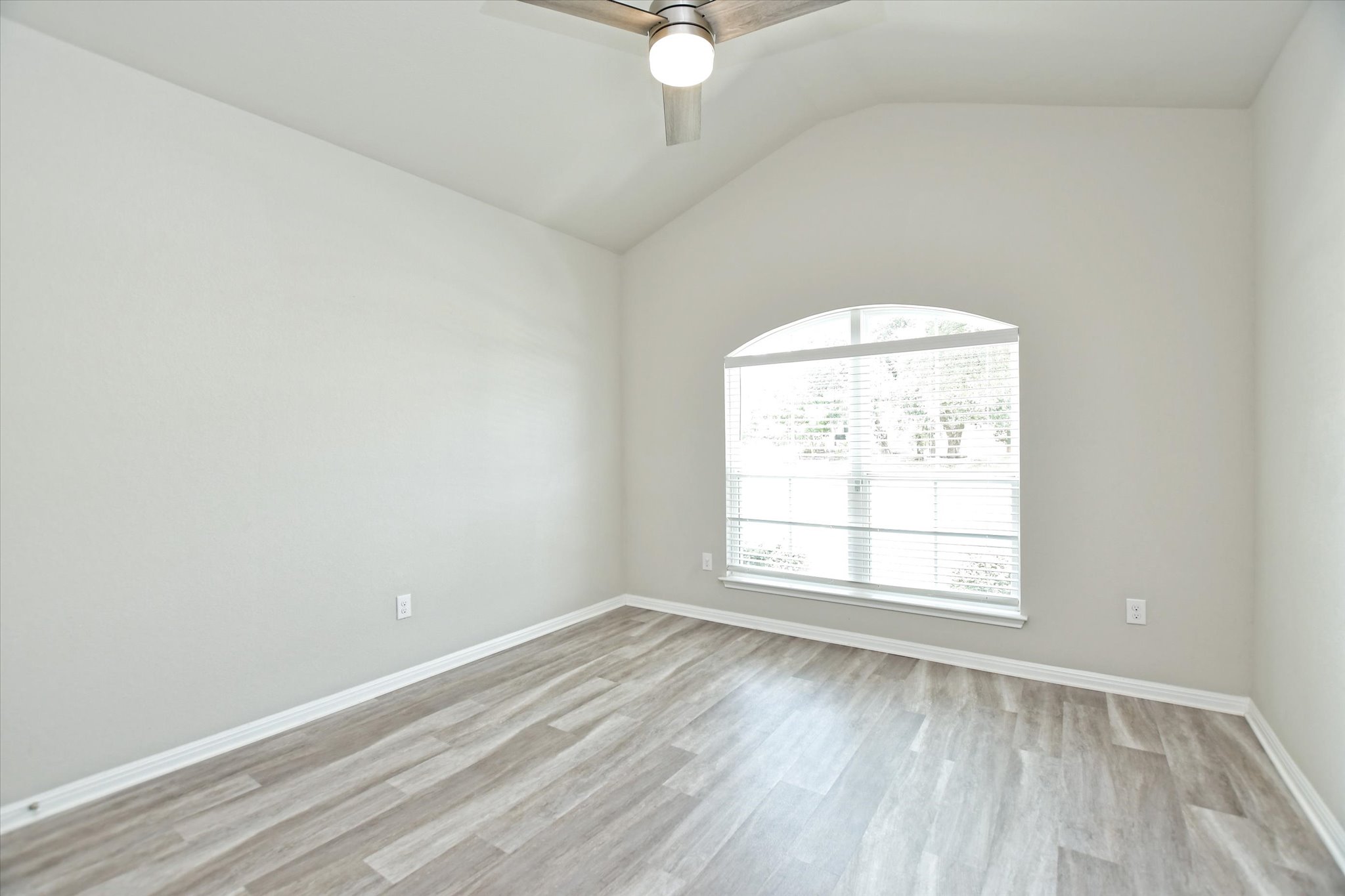 4300 Porter Farm Road Georgetown, TX 78628 - Photo 27 of 36 A quiet bedroom offers high vaulted ceilings and beautiful hardwood flooring.