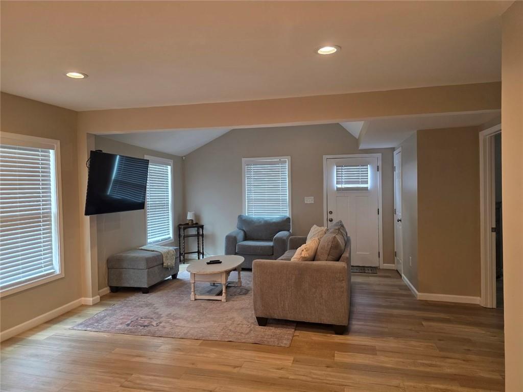 722 Lacy Street Monroe, GA 30655 - Photo 5 of 19 a living room with furniture and a wooden floor