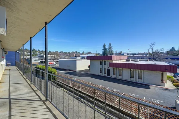 a view of a balcony with city view