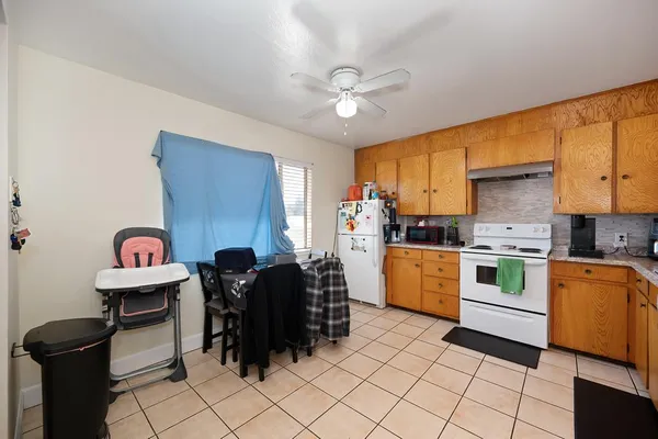a kitchen with a cabinets and appliances