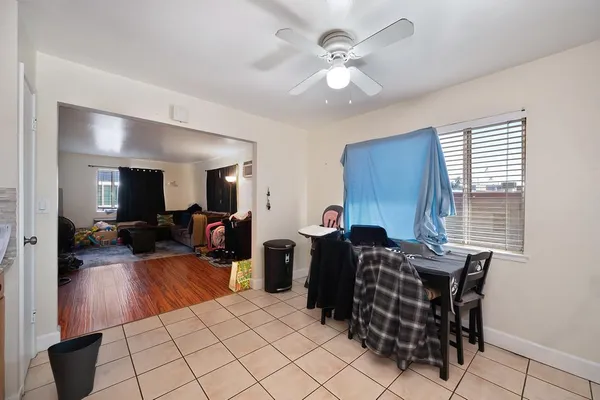 a room with furniture a flat screen tv and a window