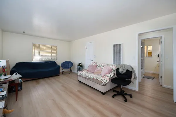 a living room with furniture rug and window