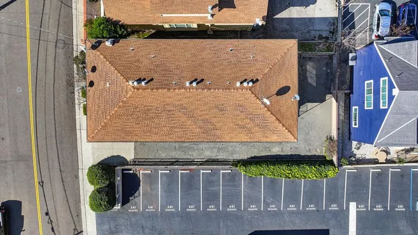an aerial view of a house with a garden