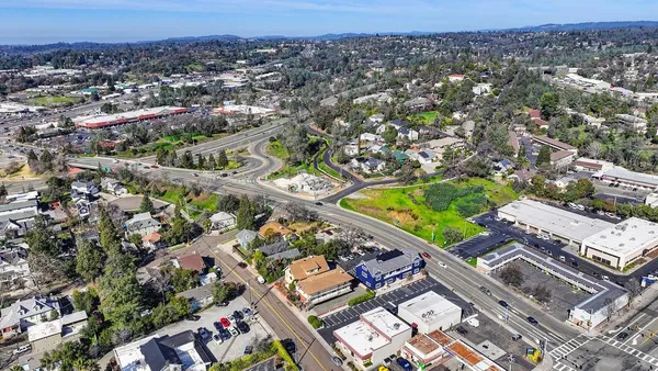 an aerial view of a house with a big yard