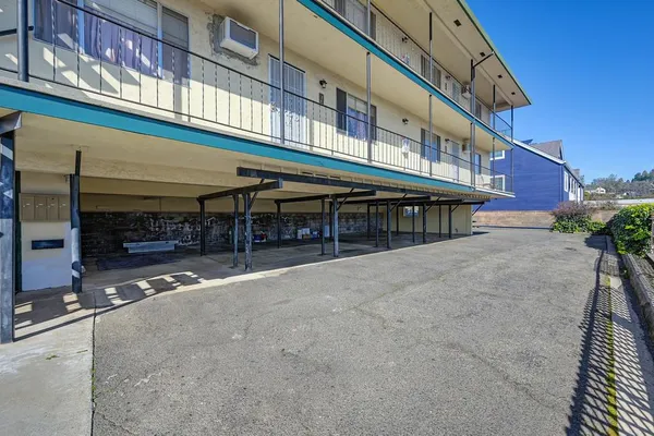 a view of a building with sitting area