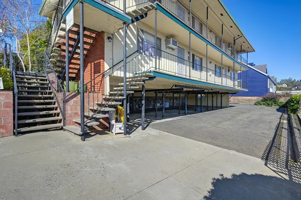 a view of a building with sitting area