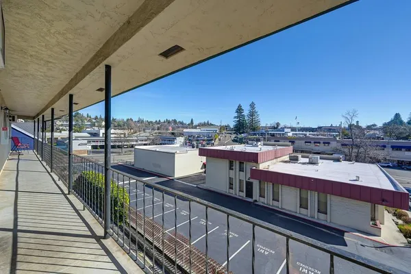a view of a balcony with city view