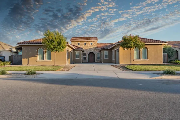 front view of a house with a small yard