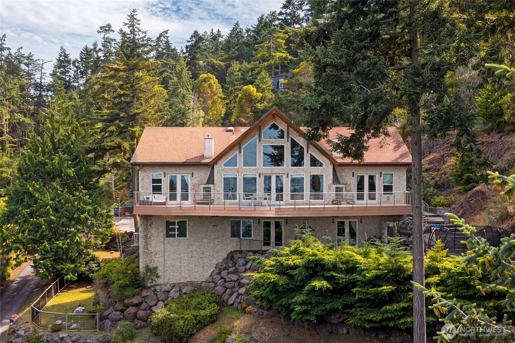 51 Willows Lane Friday Harbor, WA 98250 - Photo 39 of 40 a front view of a house with a yard and fountain in middle