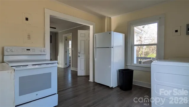 a kitchen with stainless steel appliances granite countertop a stove and a refrigerator