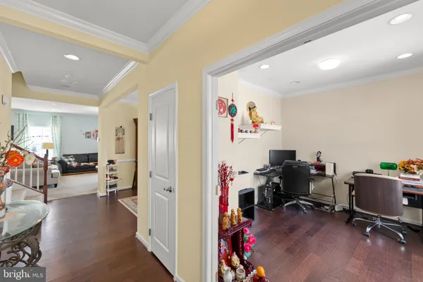 a view of a workspace with furniture and a livingroom