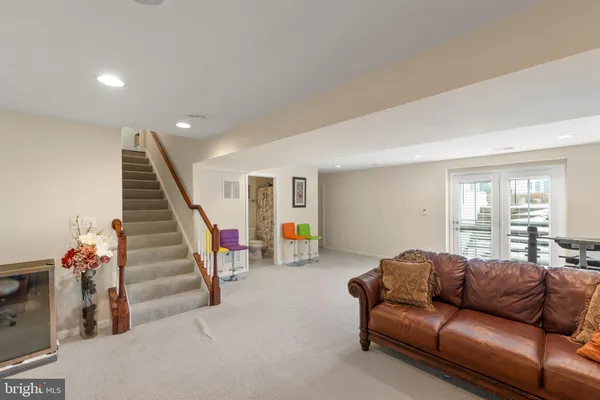 a view of game room with window and refrigerator