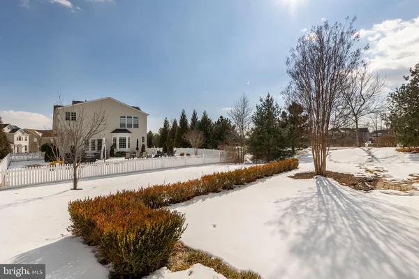 an aerial view of a house with swimming pool garden and patio