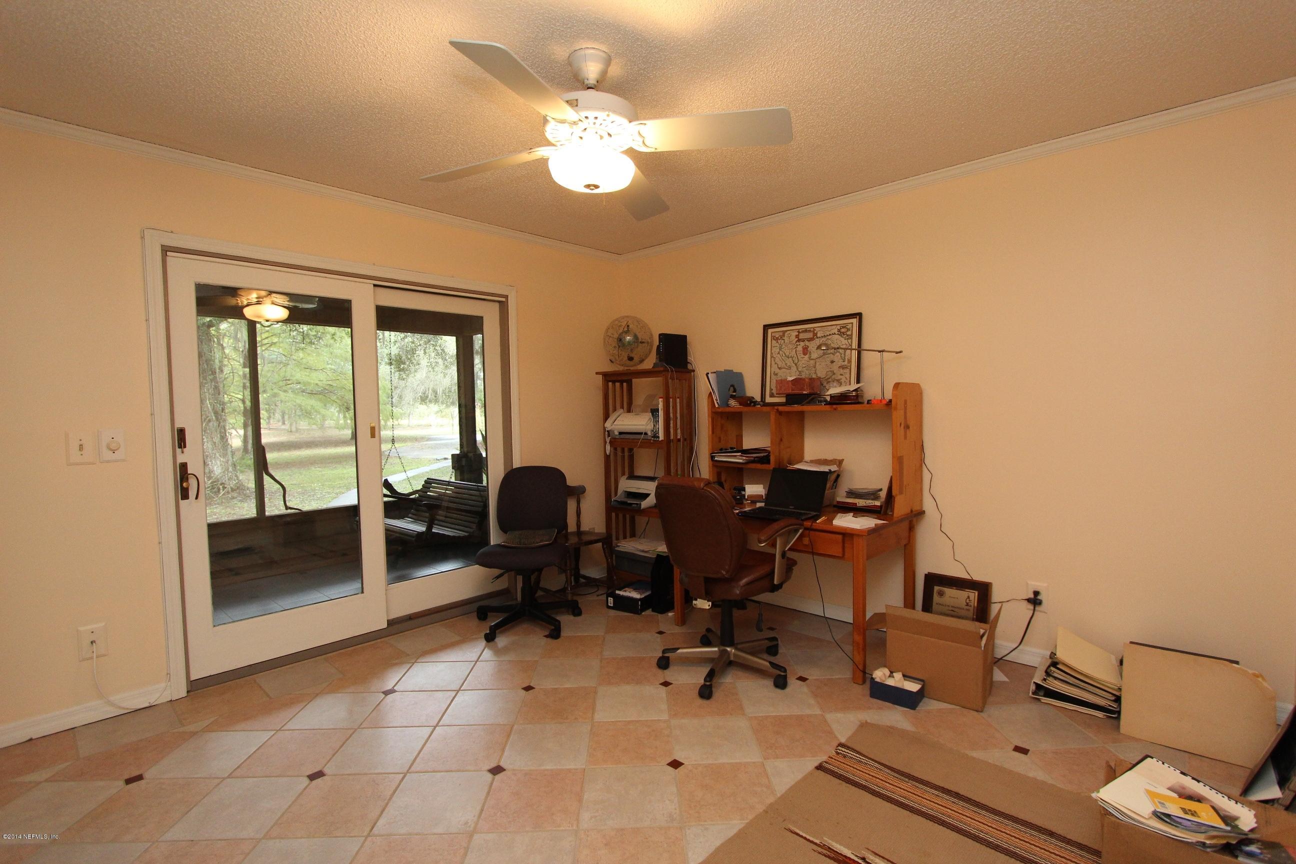13795 Sawpit Road Jacksonville, FL 32226 - Photo 22 of 69 a view of a workspace with furniture and a window